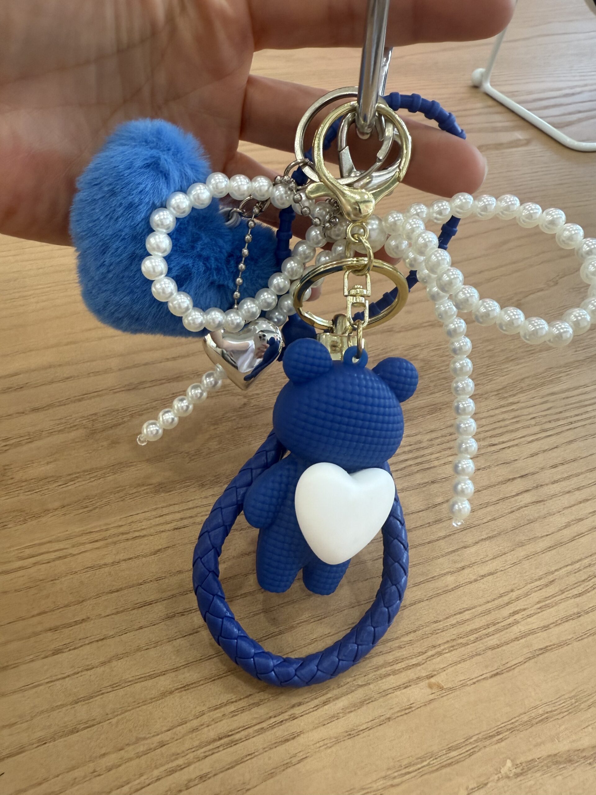 Blue personalized keychain featuring a cute bear figure and pearl decorations